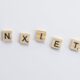 Wooden tiles on a white background spell anxiety, symbolizing mental health awareness.