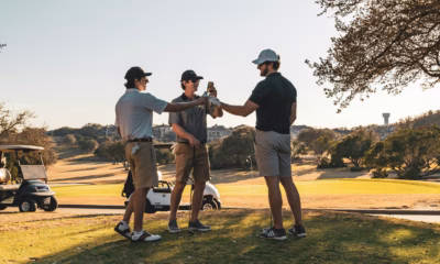 Group of weekend golfers celebrating on course — competitive golf formats for weekend golfers