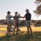 Group of weekend golfers celebrating on course — competitive golf formats for weekend golfers