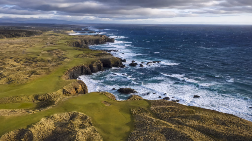 Aerial view of Bandon Dunes golf course on the Oregon coast with dramatic Pacific Ocean cliffs — best golf destinations 2026