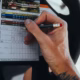 Presidents Cup 2026 odds analysis shown through a golfer marking a detailed scorecard.