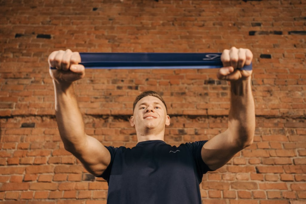 Resistance-band golf fitness workout building upper-body strength. 