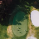 PGA Tour fall series betting analysis, an aerial view of a bunker-guarded golf green.